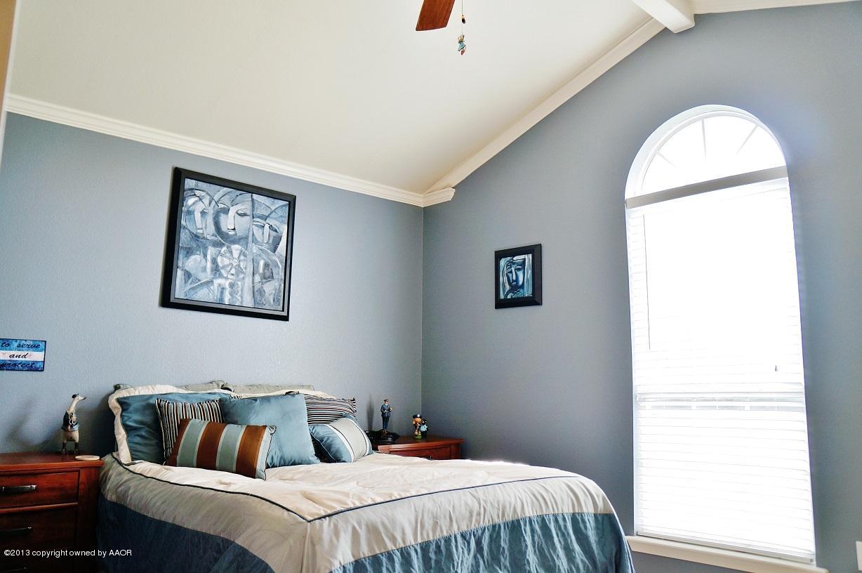 8012 Claret Street Amarillo, TX 79110 - Photo 11 of 25 a bedroom with bed and window