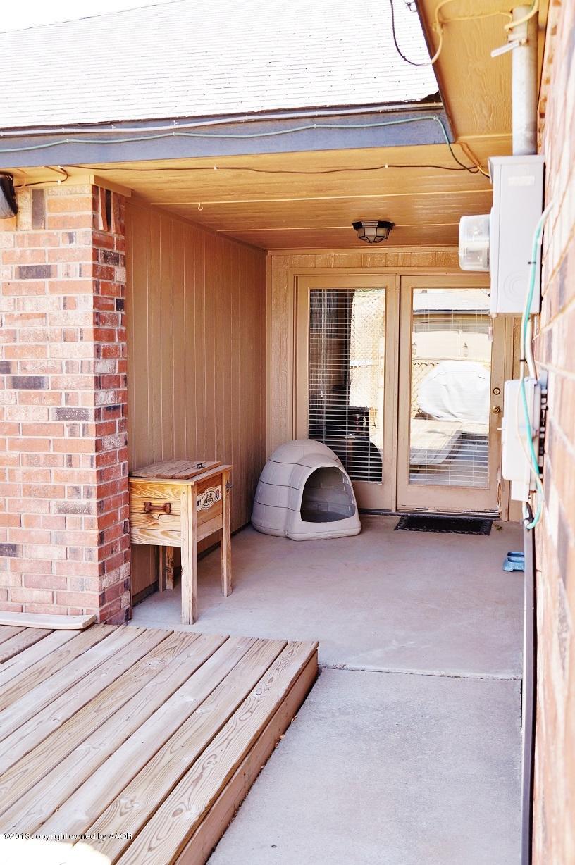 8012 Claret Street Amarillo, TX 79110 - Photo 23 of 25 a view of backyard with a table and chair