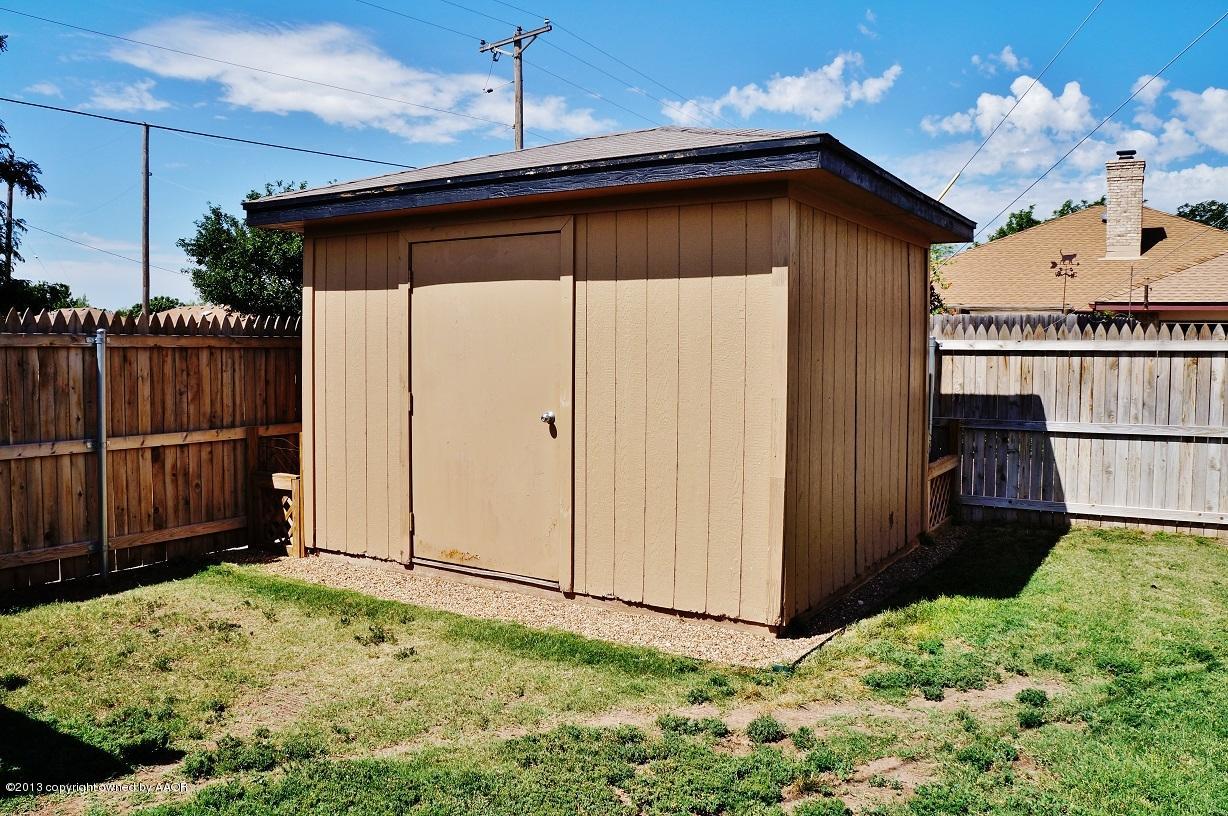 8012 Claret Street Amarillo, TX 79110 - Photo 24 of 25 a backyard of a house with wooden fence