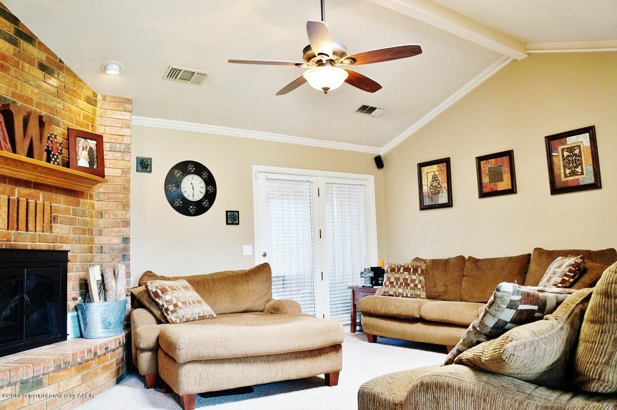 8012 Claret Street Amarillo, TX 79110 - Photo 4 of 25 a living room with furniture and a fireplace