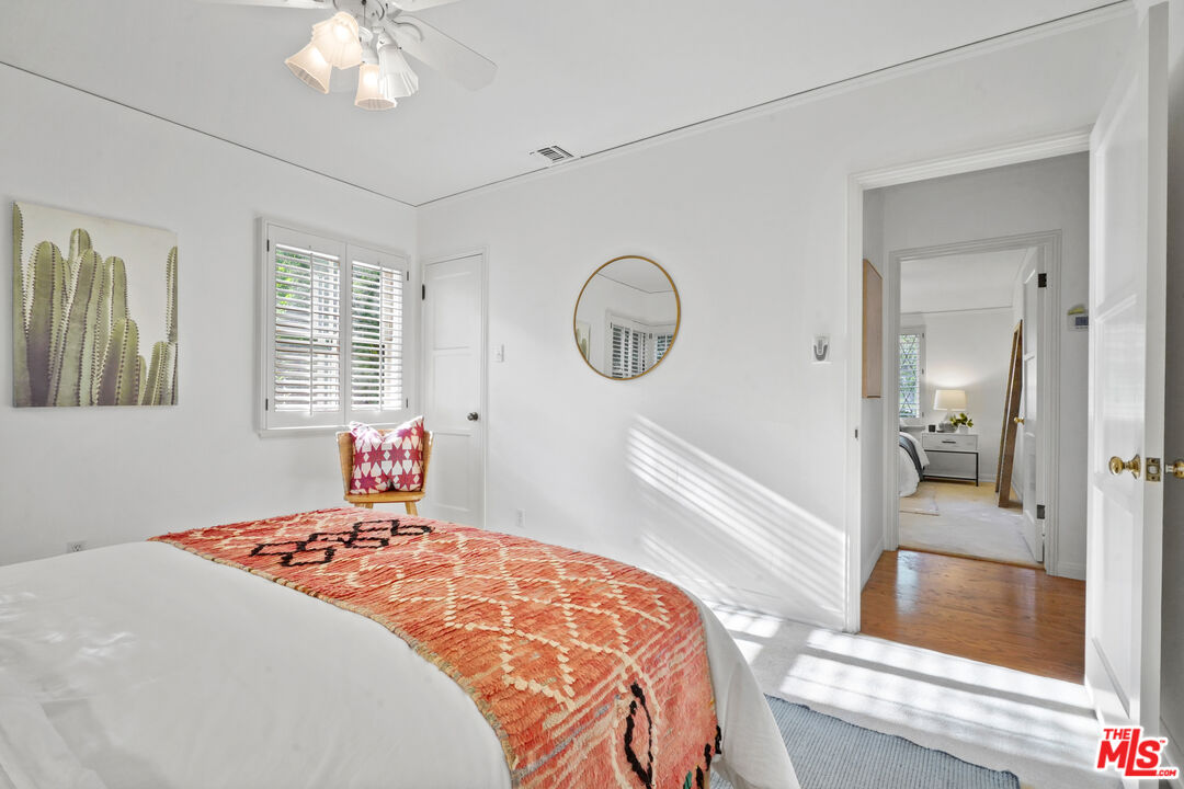 900 West Kenneth Road Glendale, CA 91202 - Photo 31 of 46 a bedroom with a bed and a chandelier