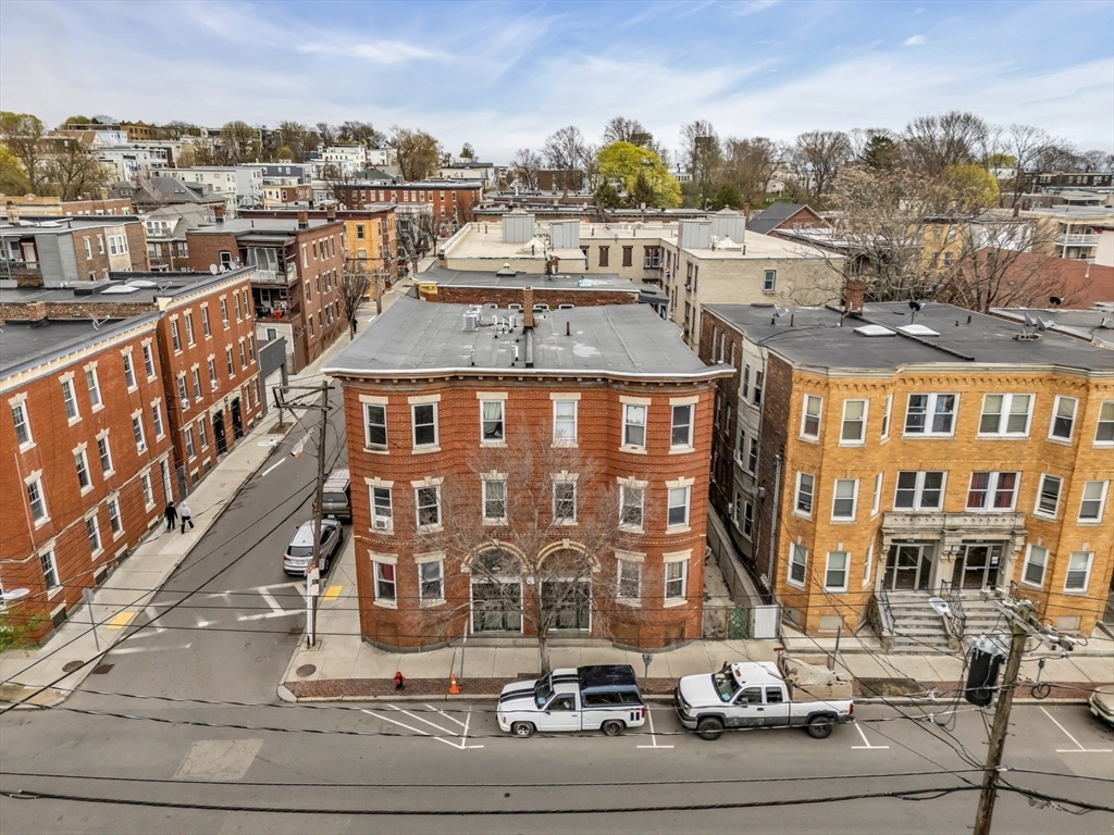 141 Hawthorne Street Chelsea, MA 02150 - Photo 2 of 7 a city view with tall buildings