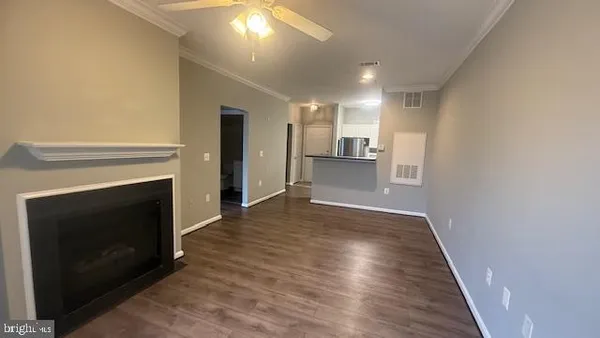 a view of a kitchen with a sink and a fireplace