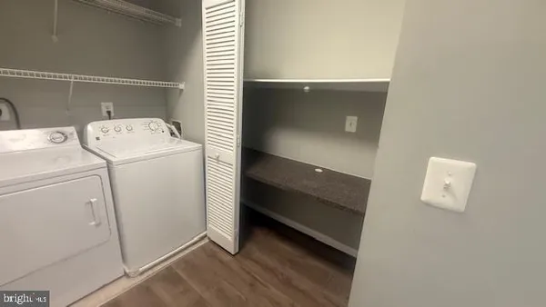 a view of storage and utility room with washer and dryer
