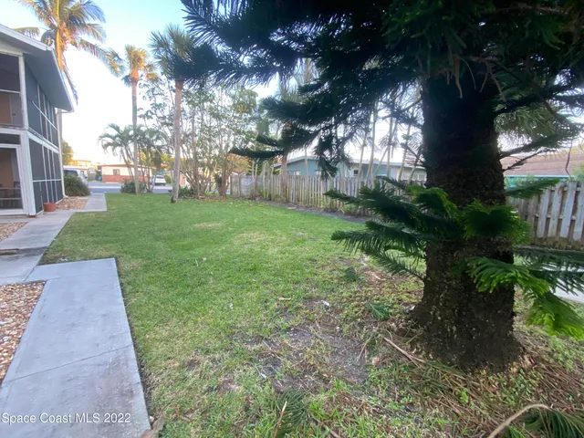 a backyard of a house with lots of green space