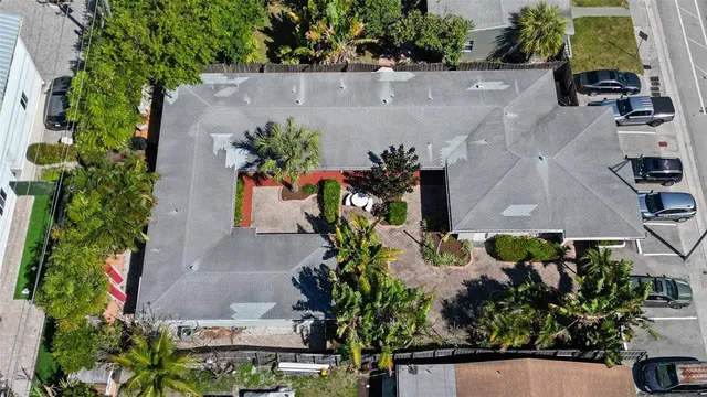 an aerial view of a house with a yard and a garden