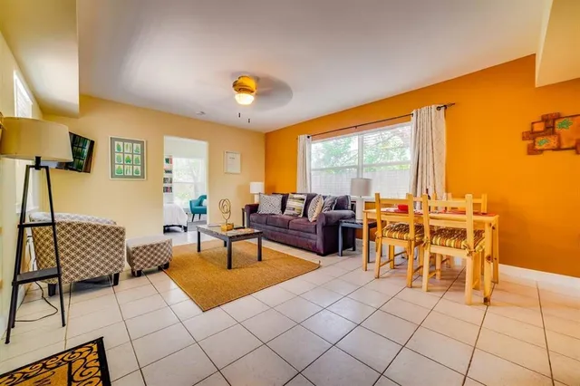 a living room with furniture and a large window