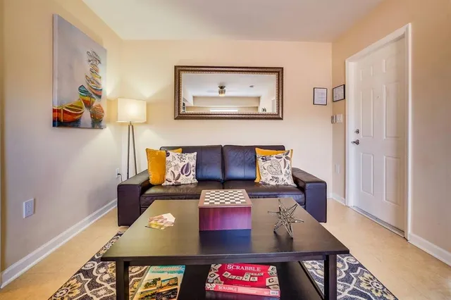 a living room with furniture and a table