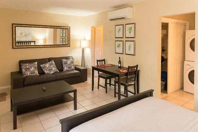 a living room with furniture and a window