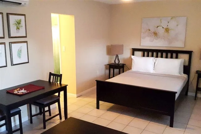 a bedroom with a bed and a table in it