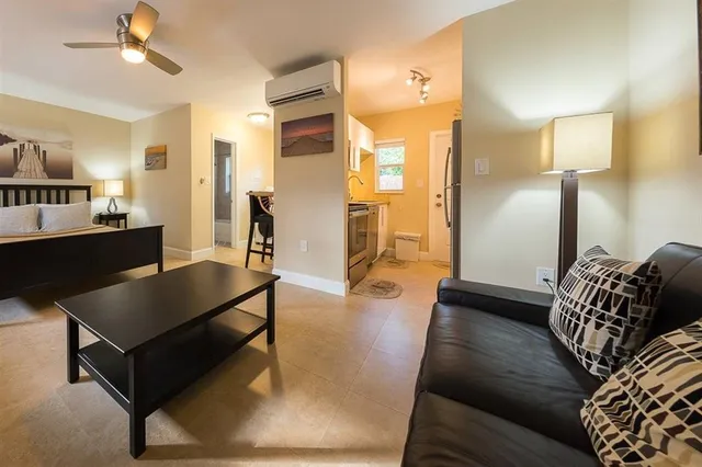 a living room with furniture and a table