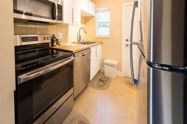 a kitchen with a stove and a refrigerator
