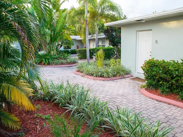 a view of a house with a garden
