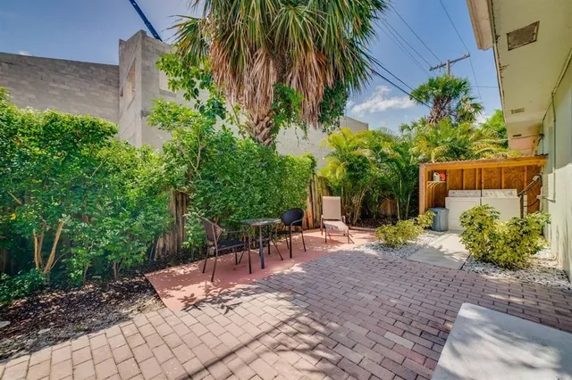 a view of a backyard with a patio