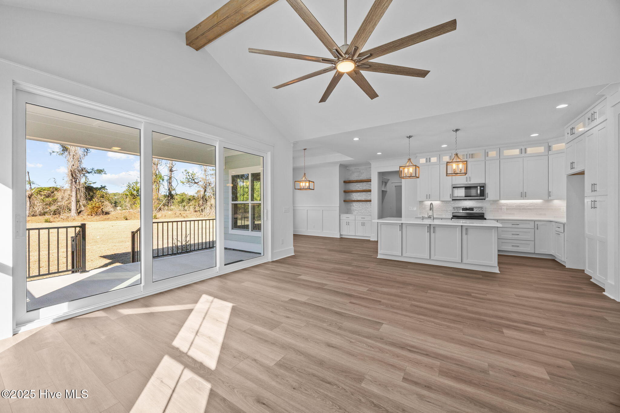 498 Genoe's Point Road Southwest Supply, NC 28462 - Photo 18 of 55 Open living concept with lots of natural light, 8ft sliders