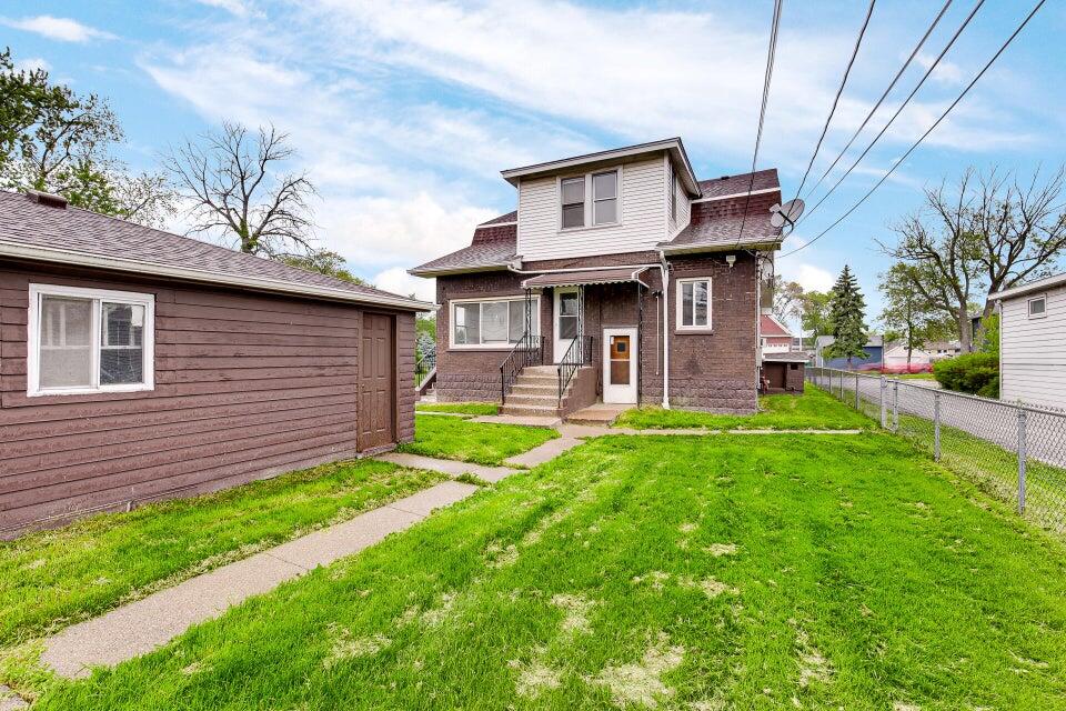 650 119th Street, Unit 1 Whiting, IN 46394 - Photo 16 of 17 a front view of a house with a yard
