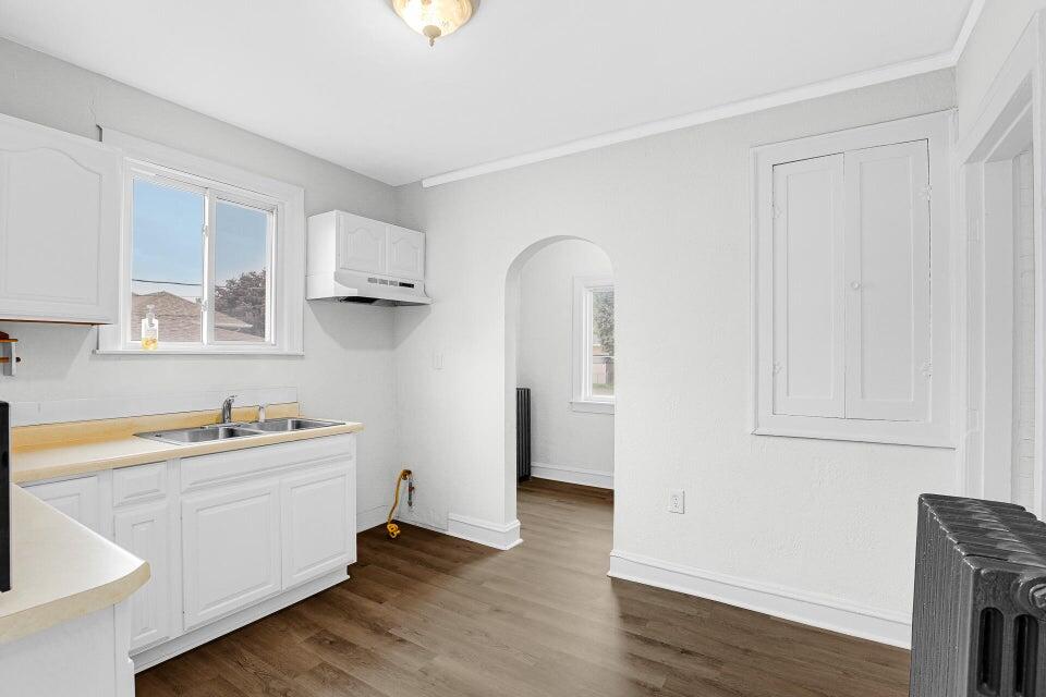 650 119th Street, Unit 1 Whiting, IN 46394 - Photo 10 of 17 a view of a kitchen with sink and dishwasher with wooden floor
