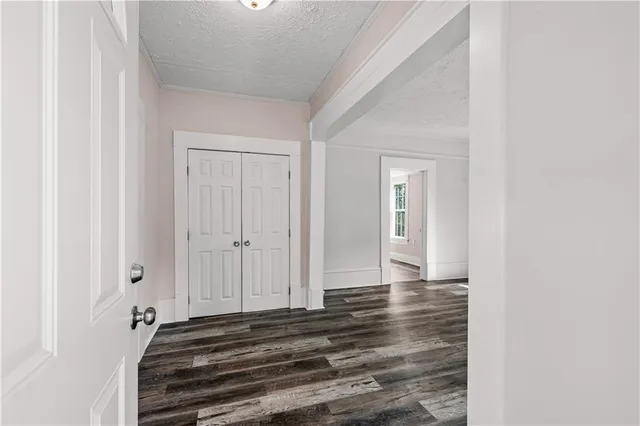a view of a closet area with rug