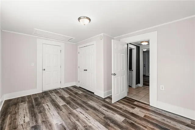 a view of a room with wooden floor