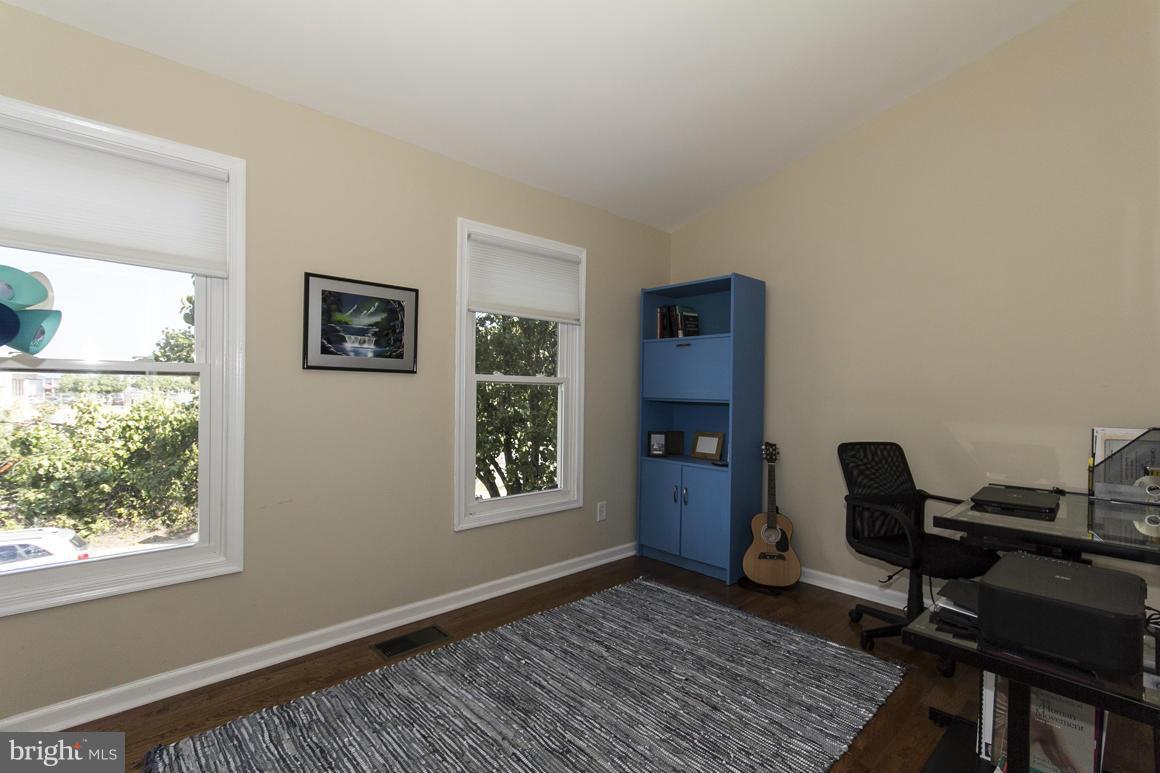 928 South Paca Street Baltimore, MD 21230 - Photo 15 of 23 Bright front bedroom w/ wood floors
