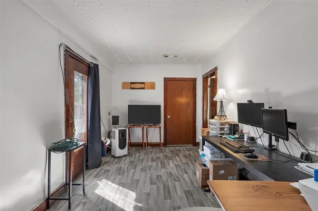 a living room with furniture a table and a flat screen tv