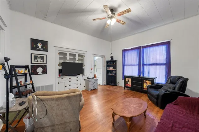 a kitchen with a refrigerator and a stove top oven