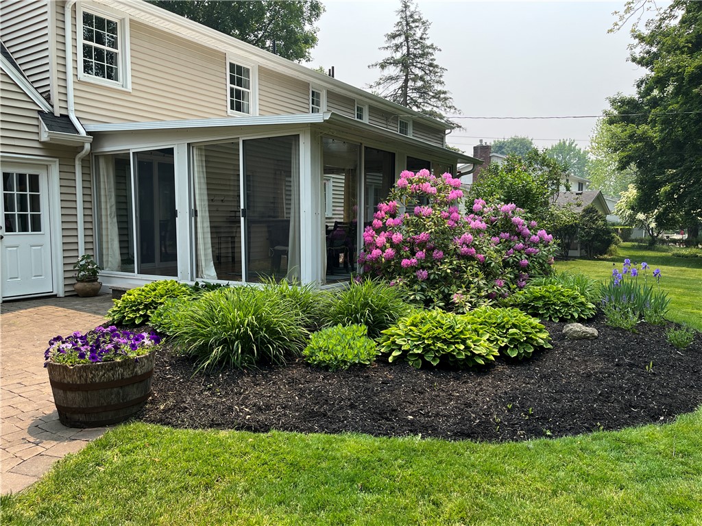 65 Jackson Rd Extension Penfield, NY 14526 - Photo 14 of 48 Backyard with covered porch