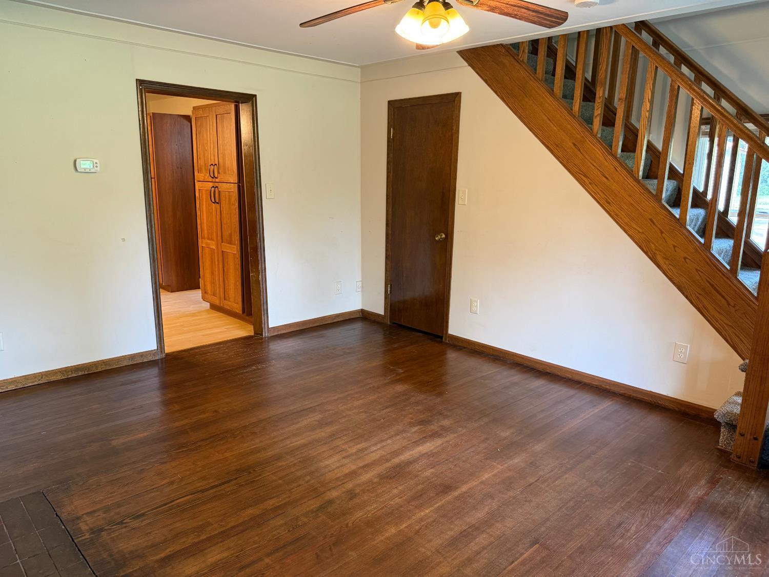 3535 Lewis Road Amelia, OH 45102 - Photo 9 of 46 The front door enters into the living room with the steps to the upstairs and entrances to the kitchen (shown) and dining room to the left (not shown)