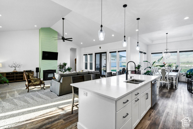 1952 Highway 118 Monroe, UT 84754 - Photo 19 of 88 Kitchen with dark wood finished floors, stainless steel dishwasher, a kitchen island with sink, white cabinets, and recessed lighting