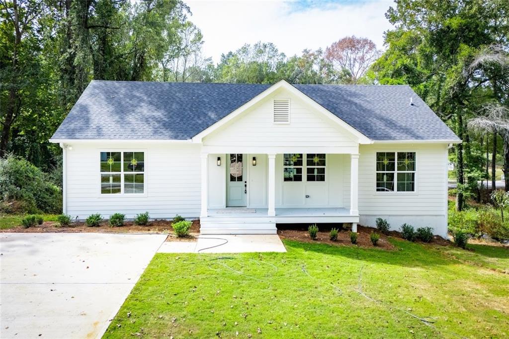 215 Rome Street Bowdon, GA 30108 - Photo 1 of 1 a view of a house with a yard