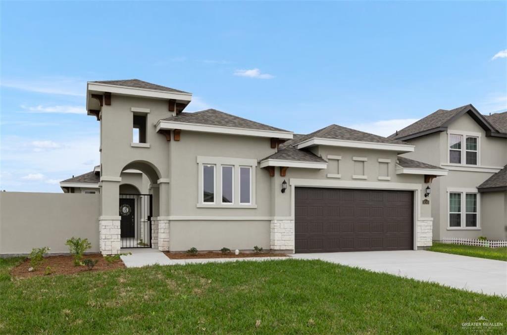14143 Wichita Falls Lane McAllen, TX 78504 - Photo 1 of 1 Prairie-style house featuring a garage and a front yard
