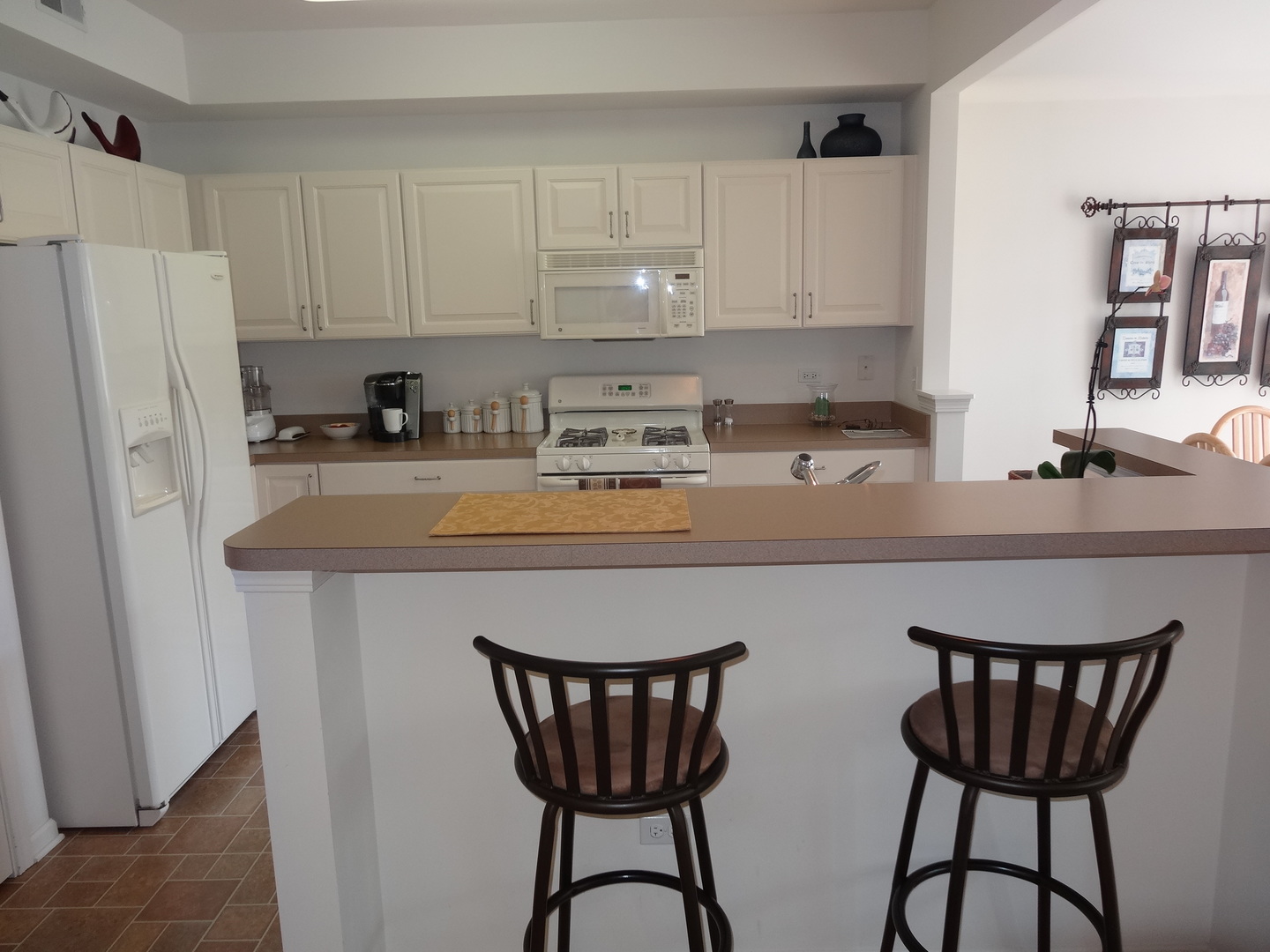 13528 Nealy Road Huntley, IL 60142 - Photo 11 of 39 a kitchen with stainless steel appliances granite countertop a white table and chairs
