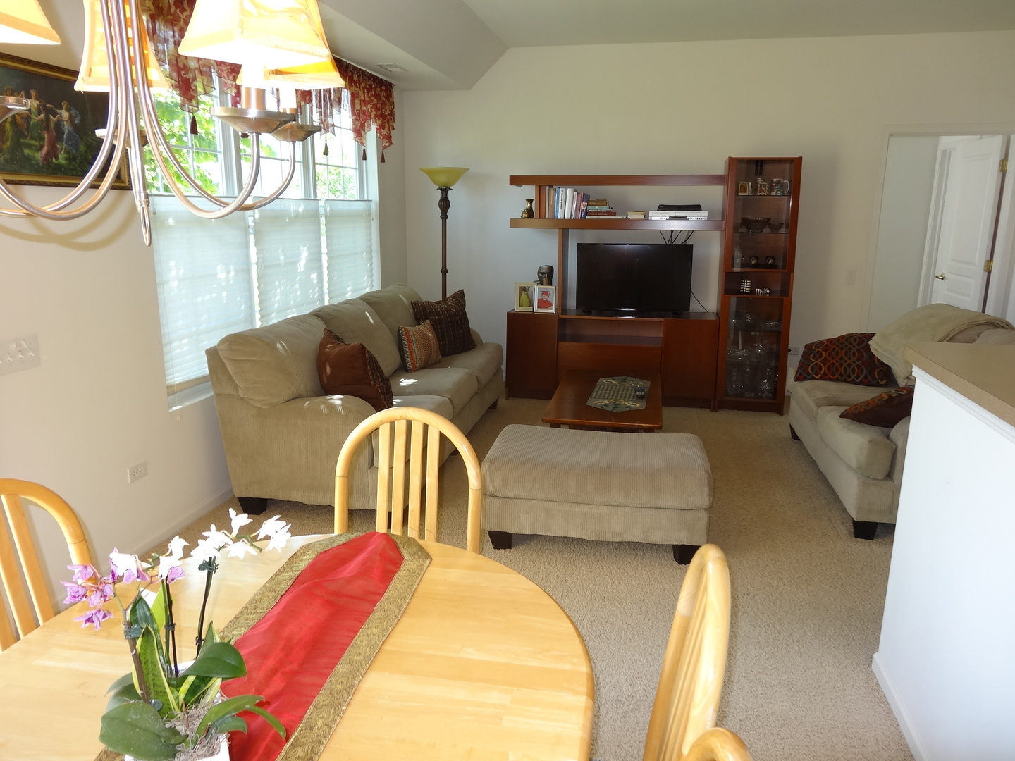 13528 Nealy Road Huntley, IL 60142 - Photo 13 of 39 a living room with furniture and a flat screen tv