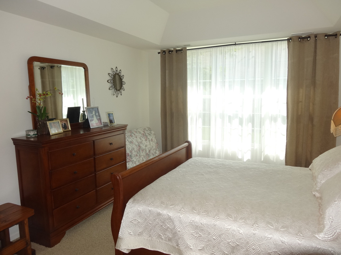 13528 Nealy Road Huntley, IL 60142 - Photo 21 of 39 a bedroom with a bed and a mirror on dresser