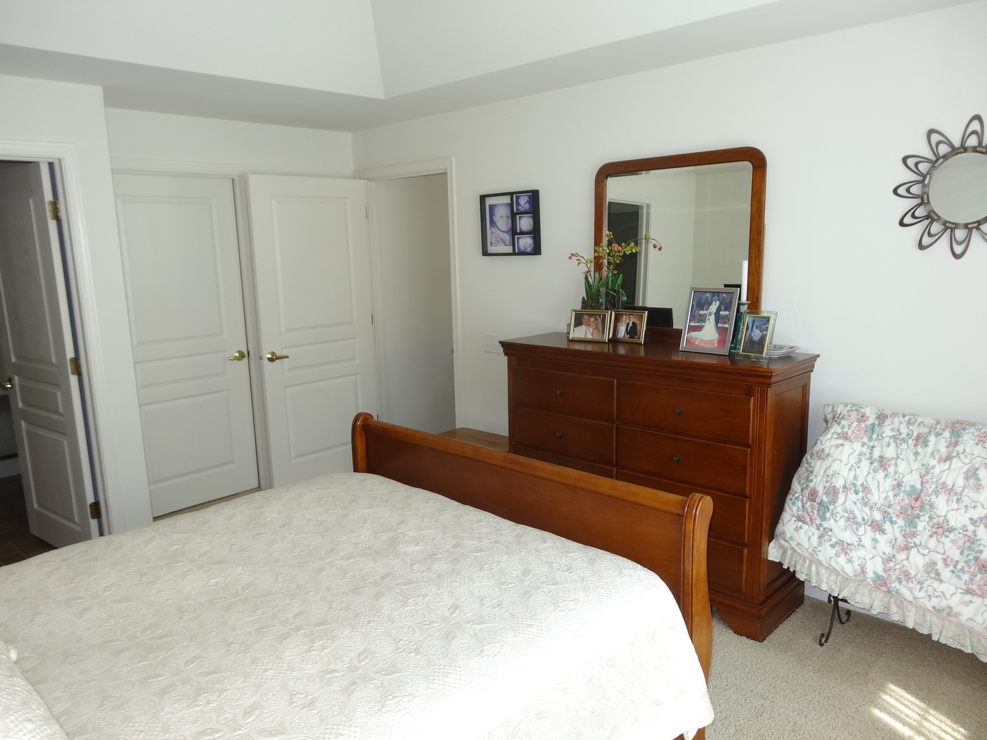 13528 Nealy Road Huntley, IL 60142 - Photo 22 of 39 a bedroom with a bed and a mirror on dresser