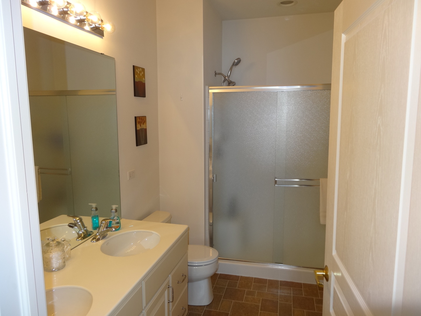 13528 Nealy Road Huntley, IL 60142 - Photo 24 of 39 a bathroom with a sink toilet and shower