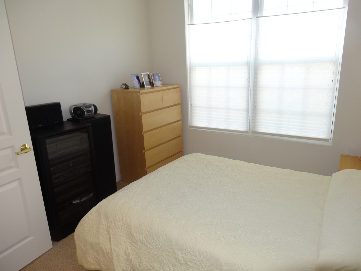13528 Nealy Road Huntley, IL 60142 - Photo 30 of 39 a bedroom with a bed and a window
