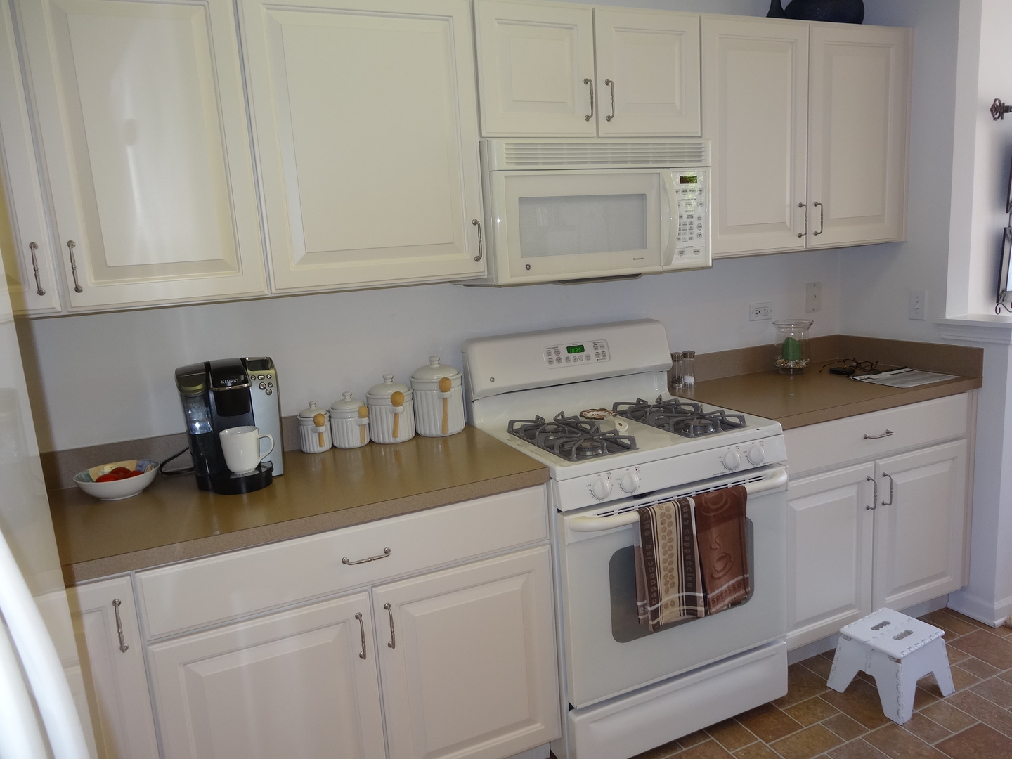 13528 Nealy Road Huntley, IL 60142 - Photo 9 of 39 a kitchen with white cabinets and white appliances