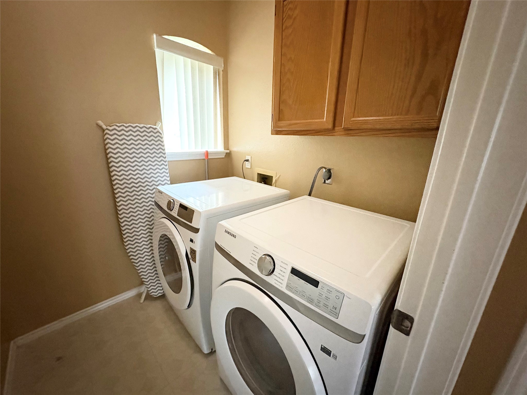 8103 Ephraim Road Austin, TX 78717 - Photo 33 of 35 A dedicated laundry room with functional appliances and ample storage space.