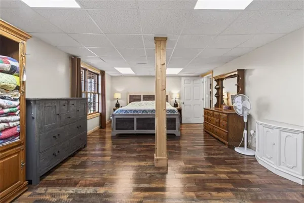 a living room with furniture and a dining table