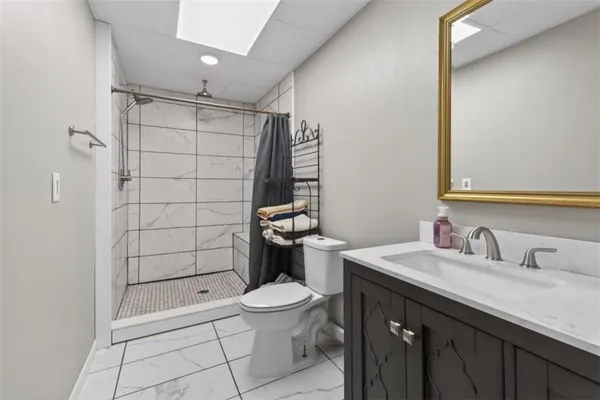 a kitchen with stainless steel appliances granite countertop a refrigerator sink and cabinets