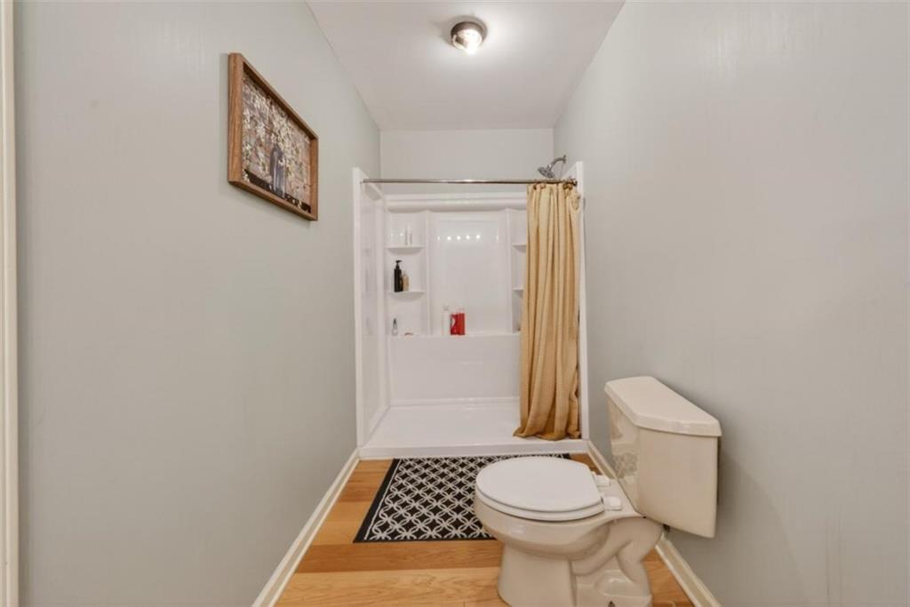 294 Hillcrest Heights Cornelia, GA 30531 - Photo 22 of 66 a bathroom with a sink toilet and shower