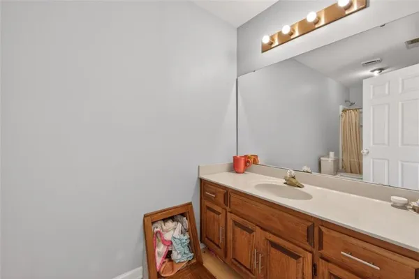 a en suite bathroom with a sink double vanity and a mirror