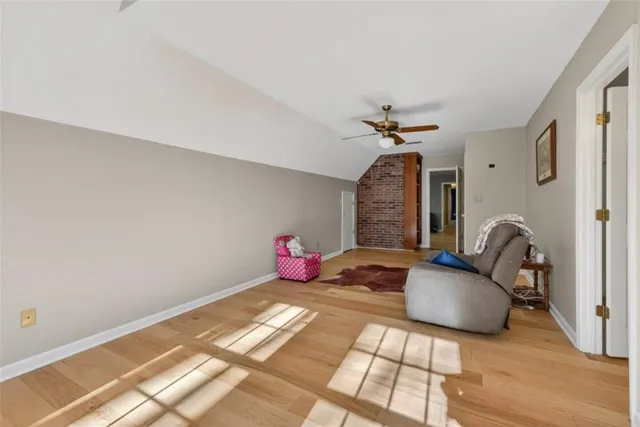 a bedroom with bed and a chandelier