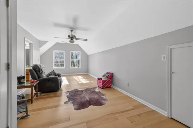 a view of a livingroom with a chandelier fan