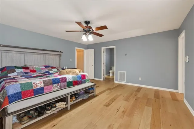 a view of staircase with railing and a chandelier
