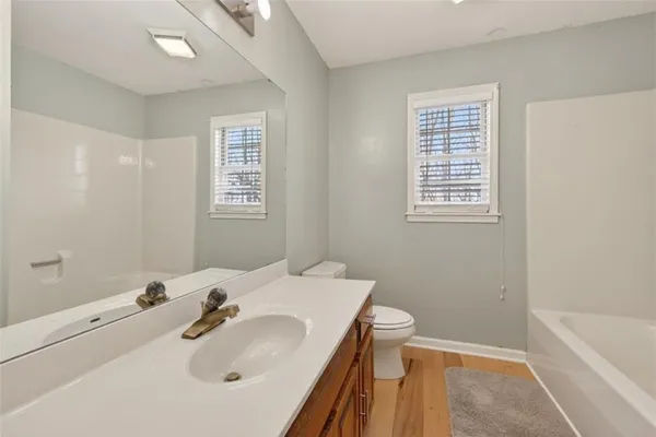 a bathroom with a sink and vanity