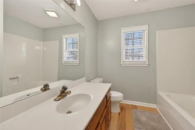 a bathroom with a sink and vanity