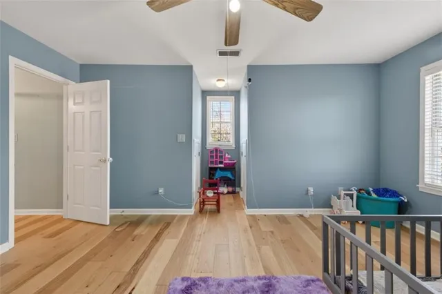 a kitchen with kitchen island granite countertop a sink and a stove top oven