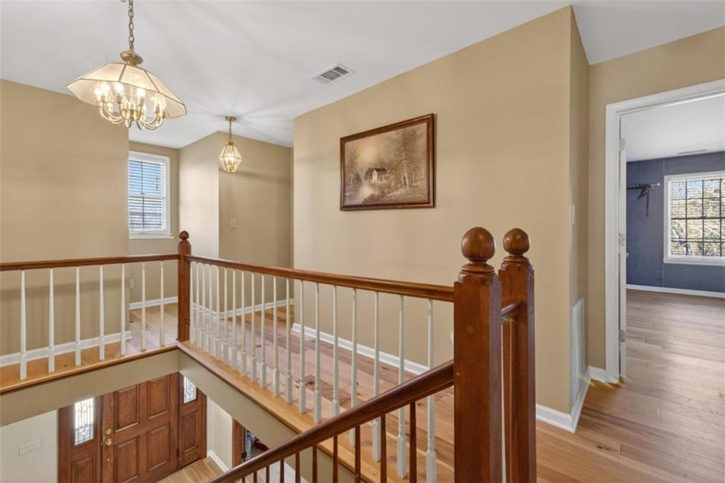294 Hillcrest Heights Cornelia, GA 30531 - Photo 39 of 66 a view of staircase with railing and a chandelier